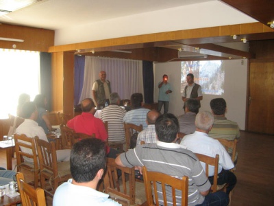 Audience and presenters at the presentation